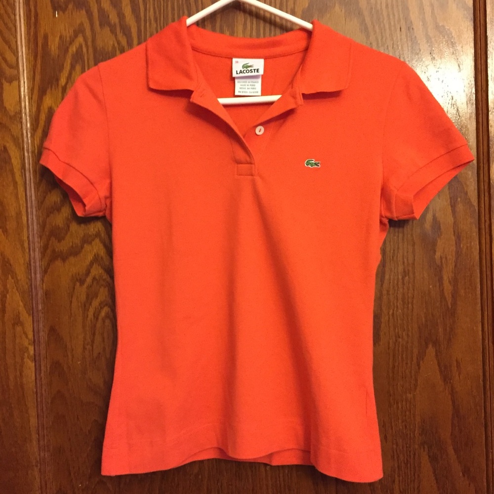 Women’s orange Lacoste short sleeve polo